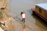 Fisherwoman carrying her coramans